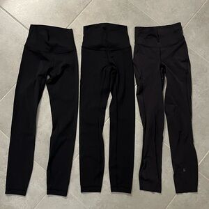 Three pairs of black lululemon leggings size 0.